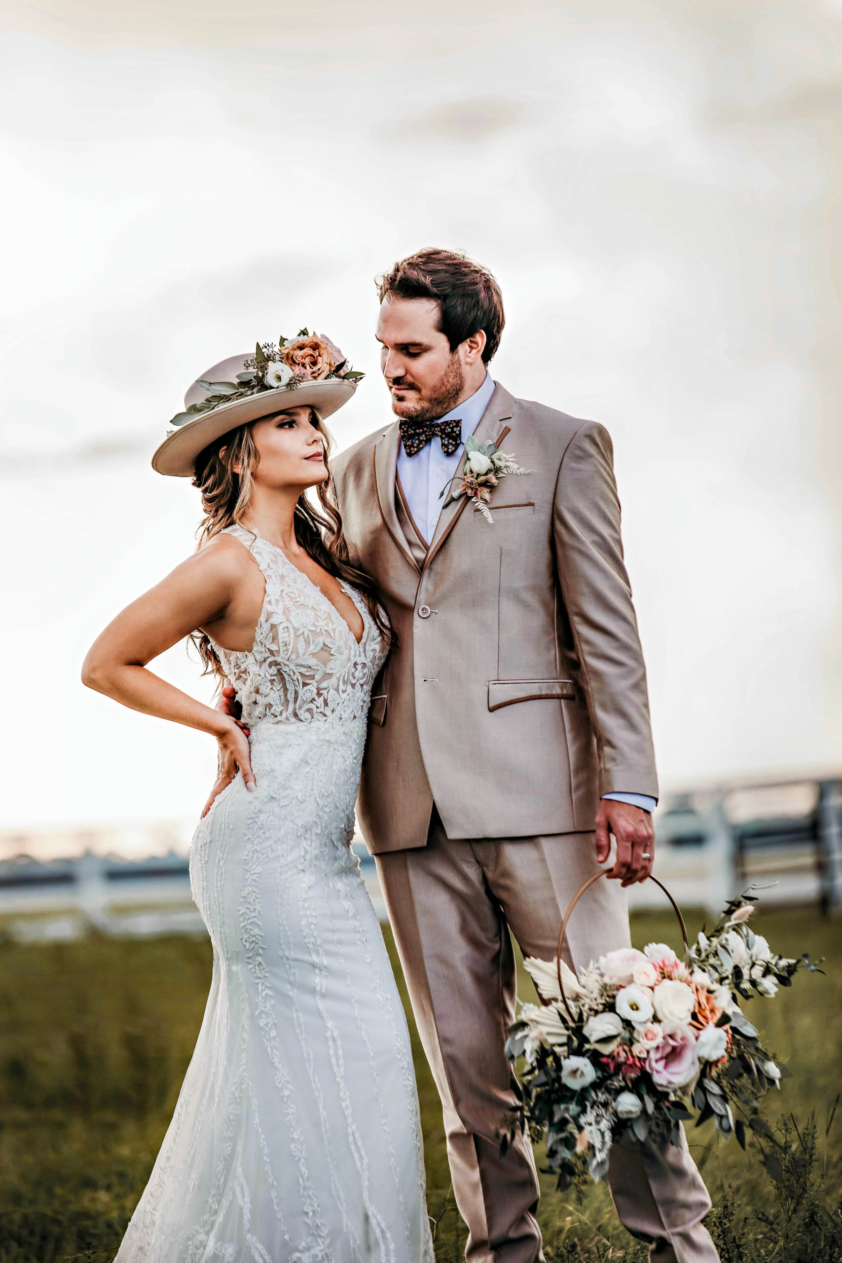a bride and groom stand close in an example of boho styled wedding photography by Garry and Stacy Photography Co in Tampa, FL
