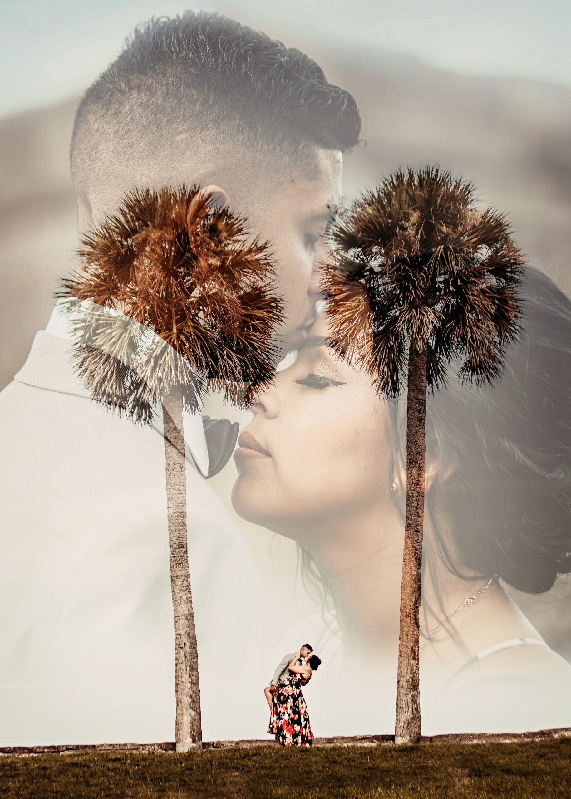 a newly engaged couple stands between two palm trees as he dips her back romantically in an engagement session by Garry & Stacy Photography Co in a St Augustine engagement photos gallery